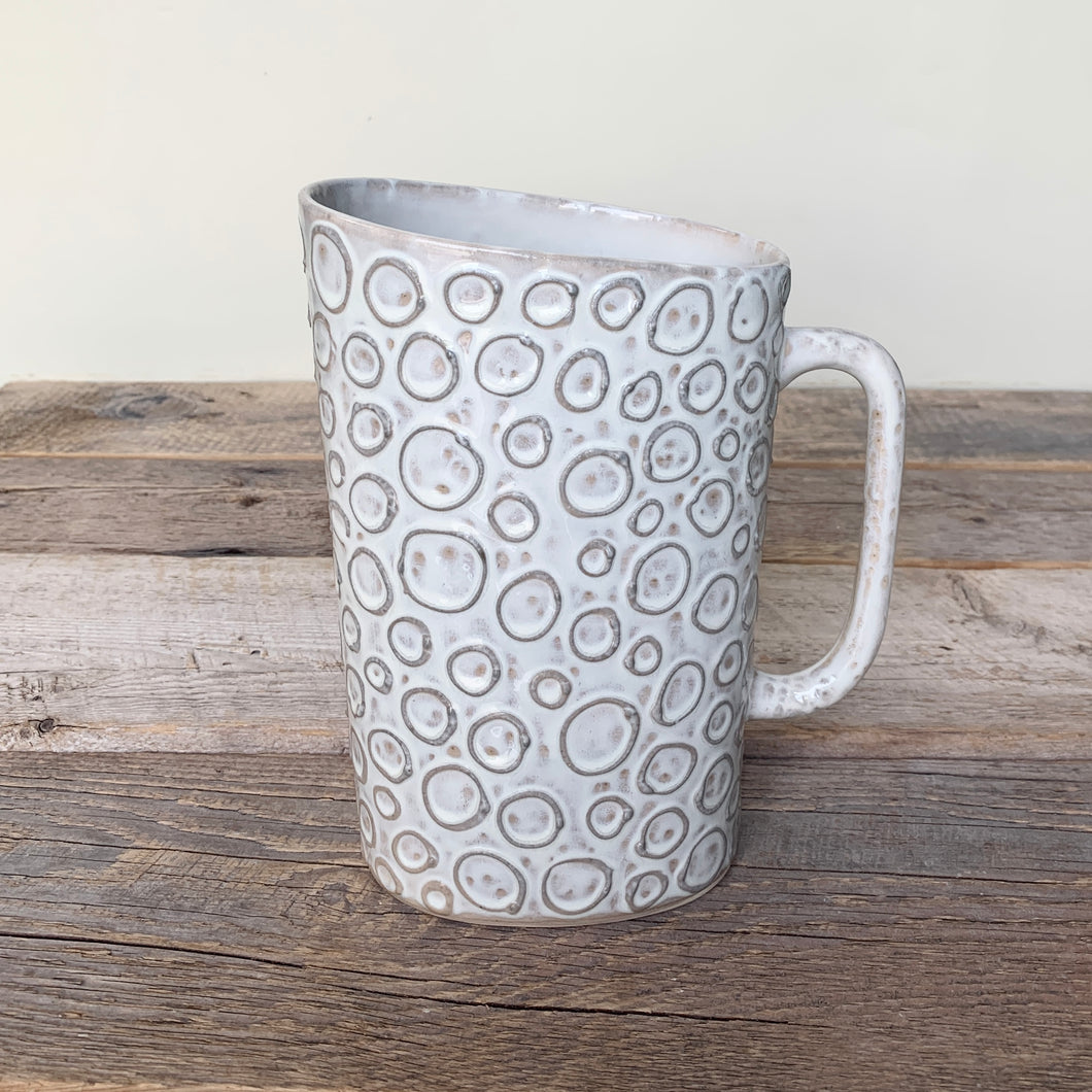 MILK JUG IN OATMEAL WITH CIRCLES