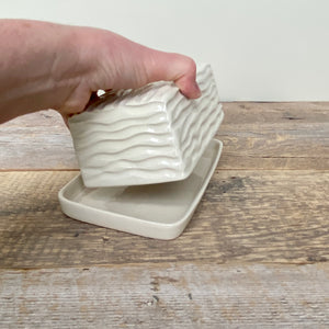 BUTTER DISH IN IVORY WITH CARVED WAVES