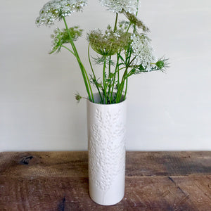 IVORY CYLINDER VASE WITH BRANCHES
