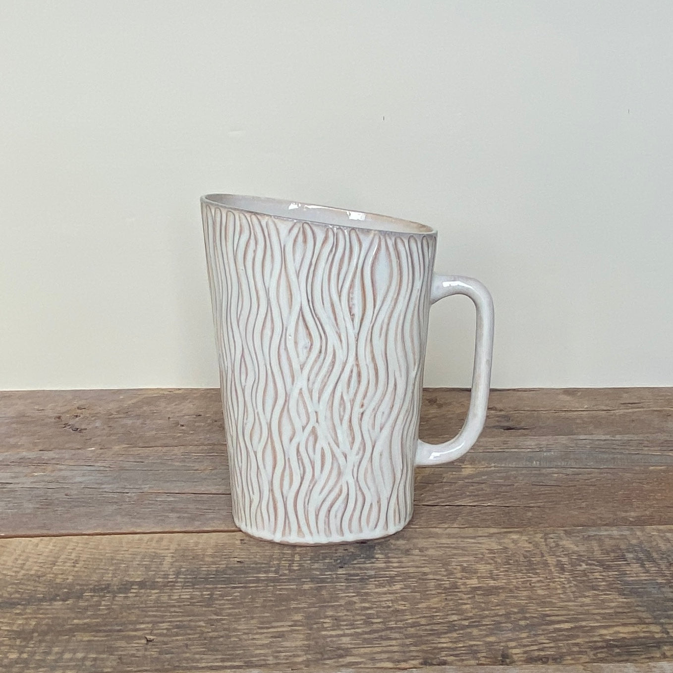 MILK JUG IN OATMEAL WITH VERTIVAL WAVES